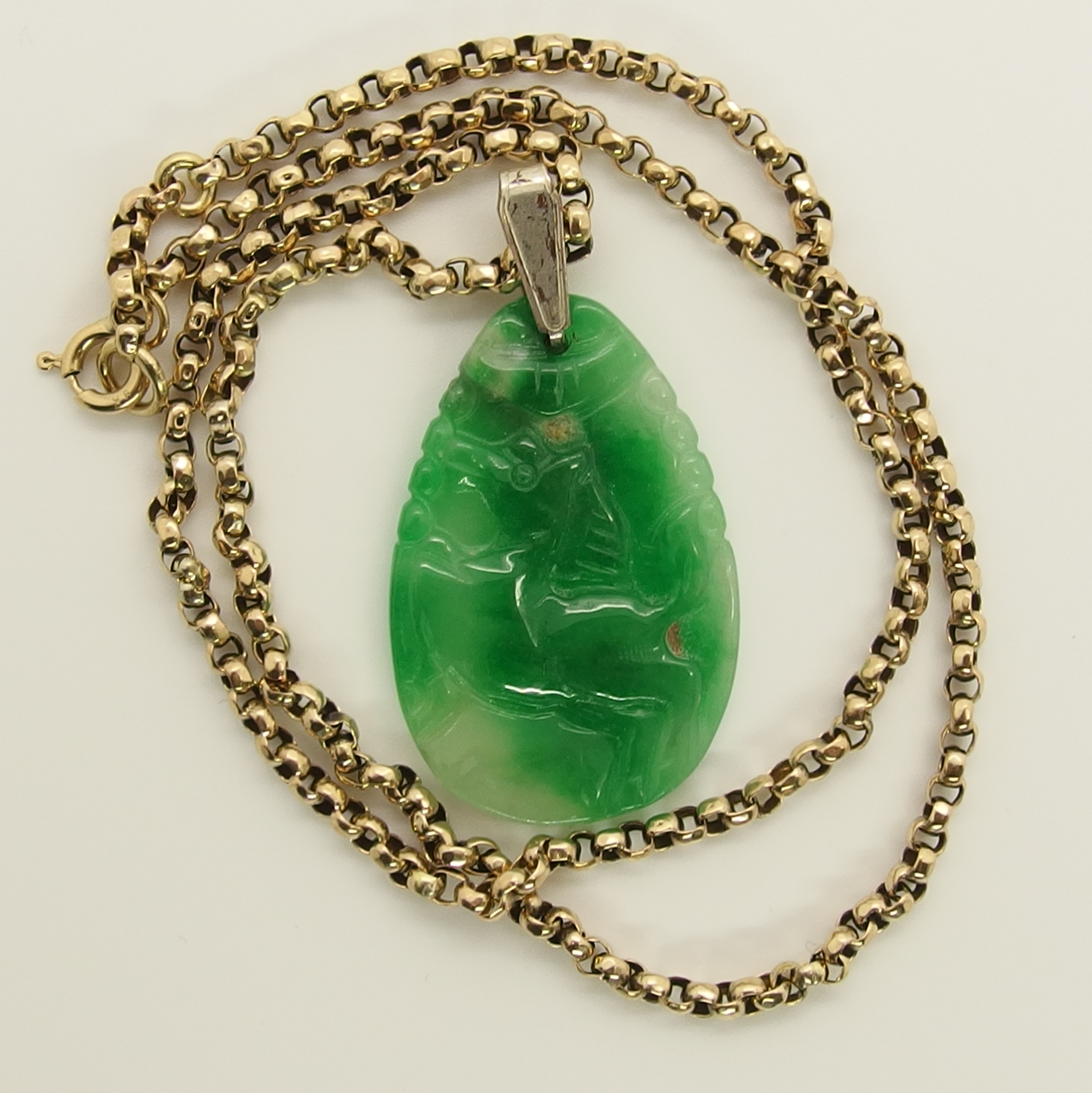 A Chinese green hardstone pendant and a Japanese demon mask pendant the hardstone pendant is - Image 5 of 7
