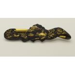 A Japanese shakudo ware brooch depicting mount Fuji, birds and foliage, dimensions 7.7cm x 2cm,