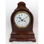A mahogany cased eight day fusee bracket clock with enamel dial having Arabic numeral markers,