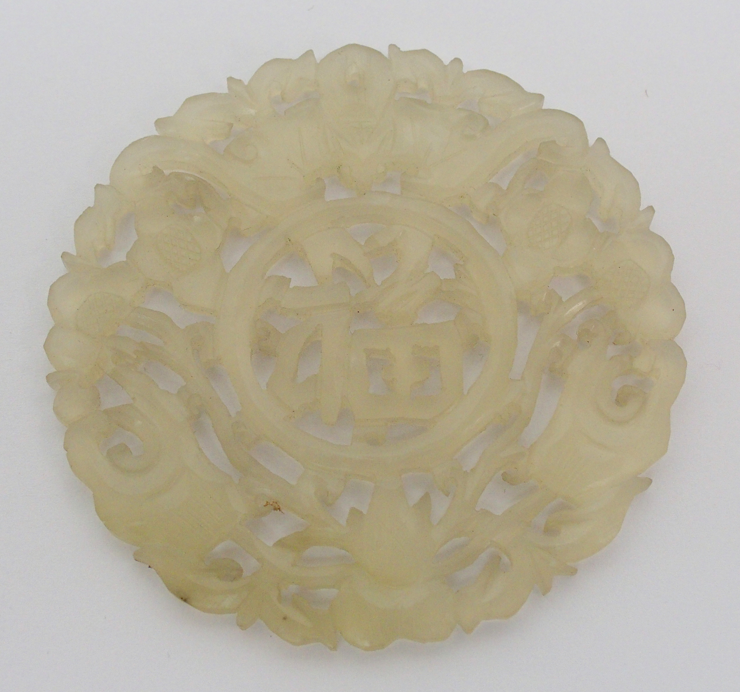 A Chinese hardstone medallion carved with bats surrounding characters, 7cm diameter, wood stand - Image 5 of 10