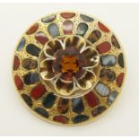 A yellow metal Scottish agate inlaid brooch the centre set with an orange citrine of approx 9.5mm,