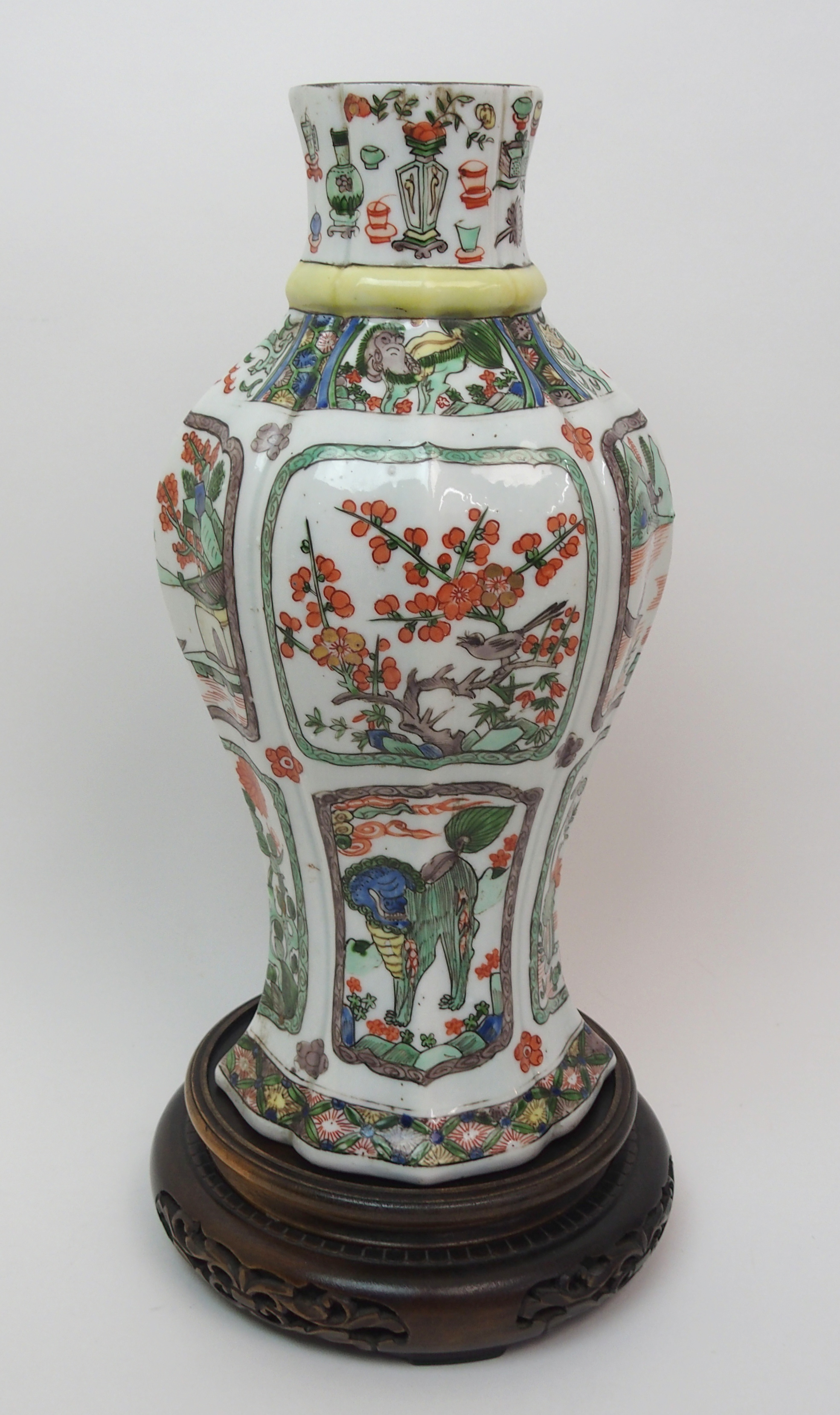 A Chinese famille verte lobed octagonal vase painted with animals, birds and foliage, 29cm high,