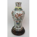 A Chinese famille verte lobed octagonal vase painted with animals, birds and foliage, 29cm high,