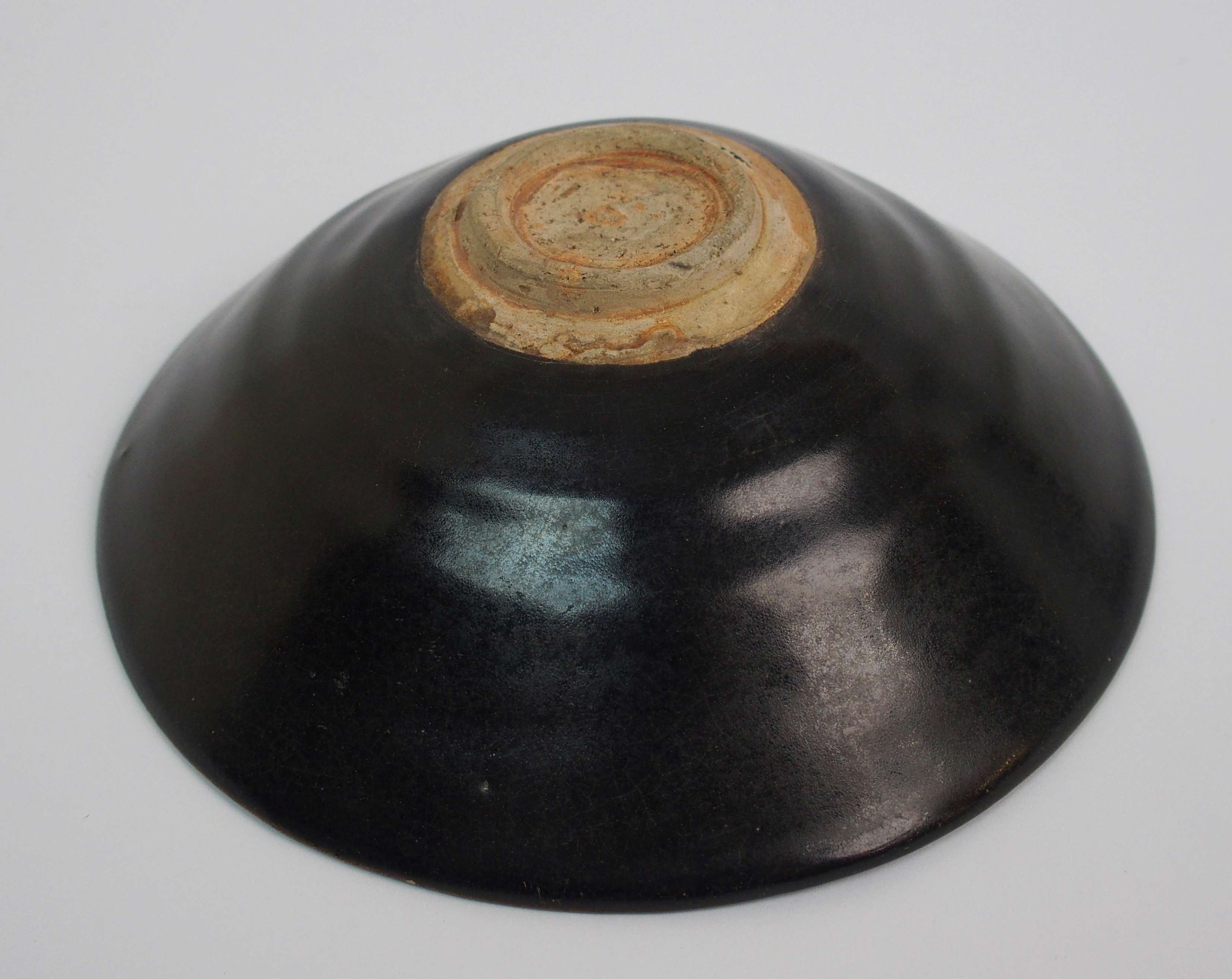 A Chinese black glazed bowl with single leaf decoration, 15.5cm diameter - Image 9 of 10