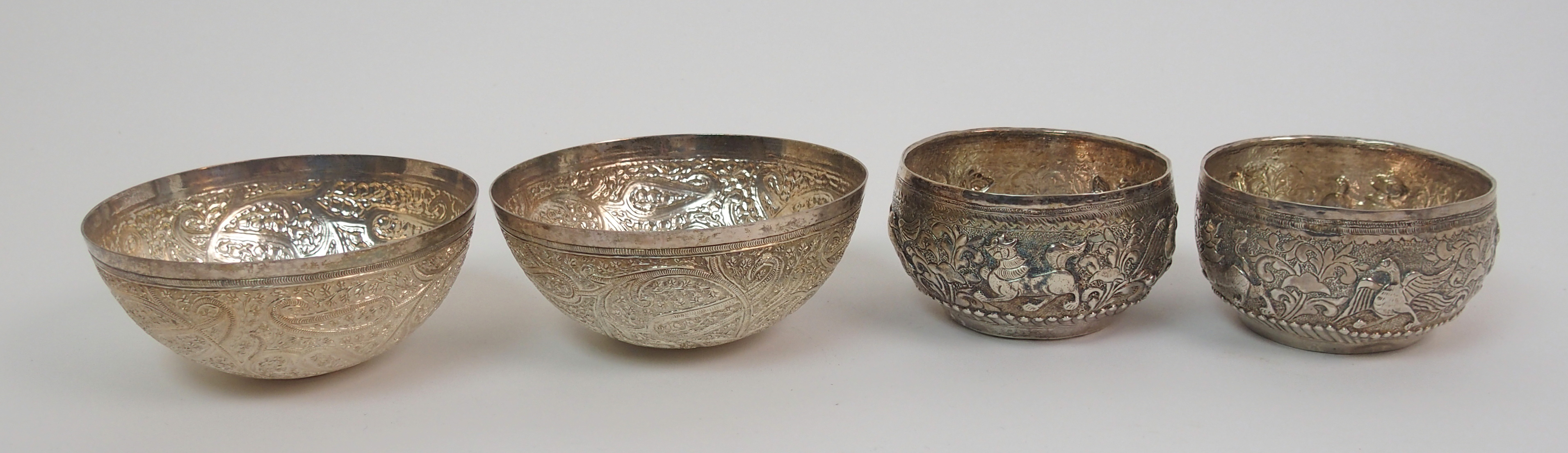 Nine Eastern white metal bowls 7.5 to 9.5cm diameter, a salver decorated with animals 26cm - Image 9 of 10