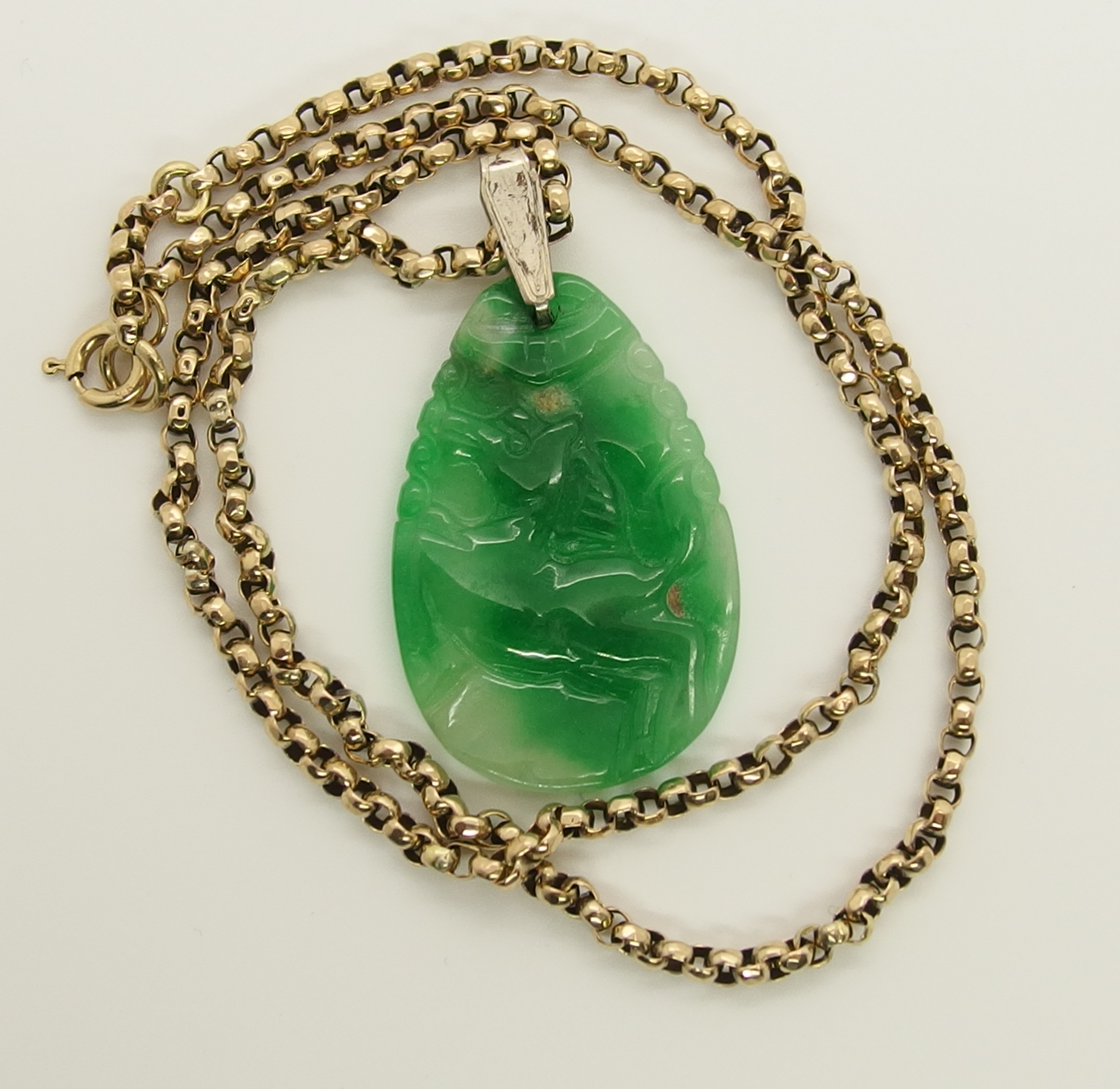 A Chinese green hardstone pendant and a Japanese demon mask pendant the hardstone pendant is - Image 6 of 7