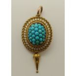 A yellow metal Etruscan revival turquoise and white enamel pendant length 4.3cm x 2cm, weight 6gms