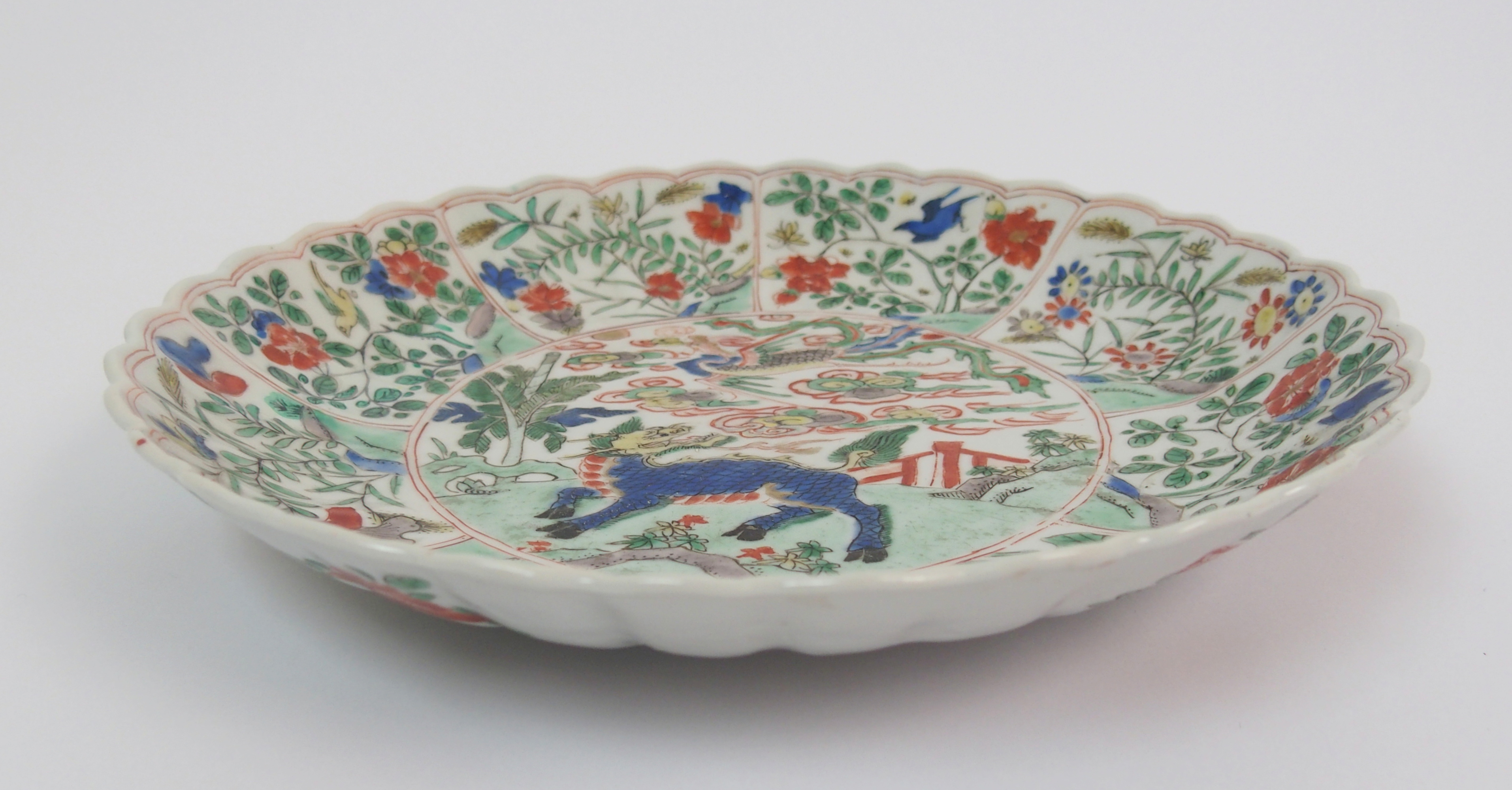 A Chinese lobed dish painted with a kylin and phoenix within panels of birds amongst flowering - Image 3 of 10