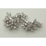 A white metal diamond spray brooch of estimated approx 3cts of brilliant and baguette diamonds,
