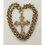 A vintage 9ct cross and chain the facet cut belcher chain has a soldered on tag stamped 9ct, the