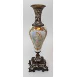 A Continental porcelain urn with chapleve enamel base and neck, the lustre glazed body of the vase