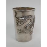 A Chinese silver beaker decorated with a scrolling dragon, stamped CC, 3oz, 7.5cm high