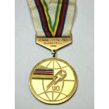 A yellow-metal and enamel World Championship Men's Individual Pursuit gold medal the obverse