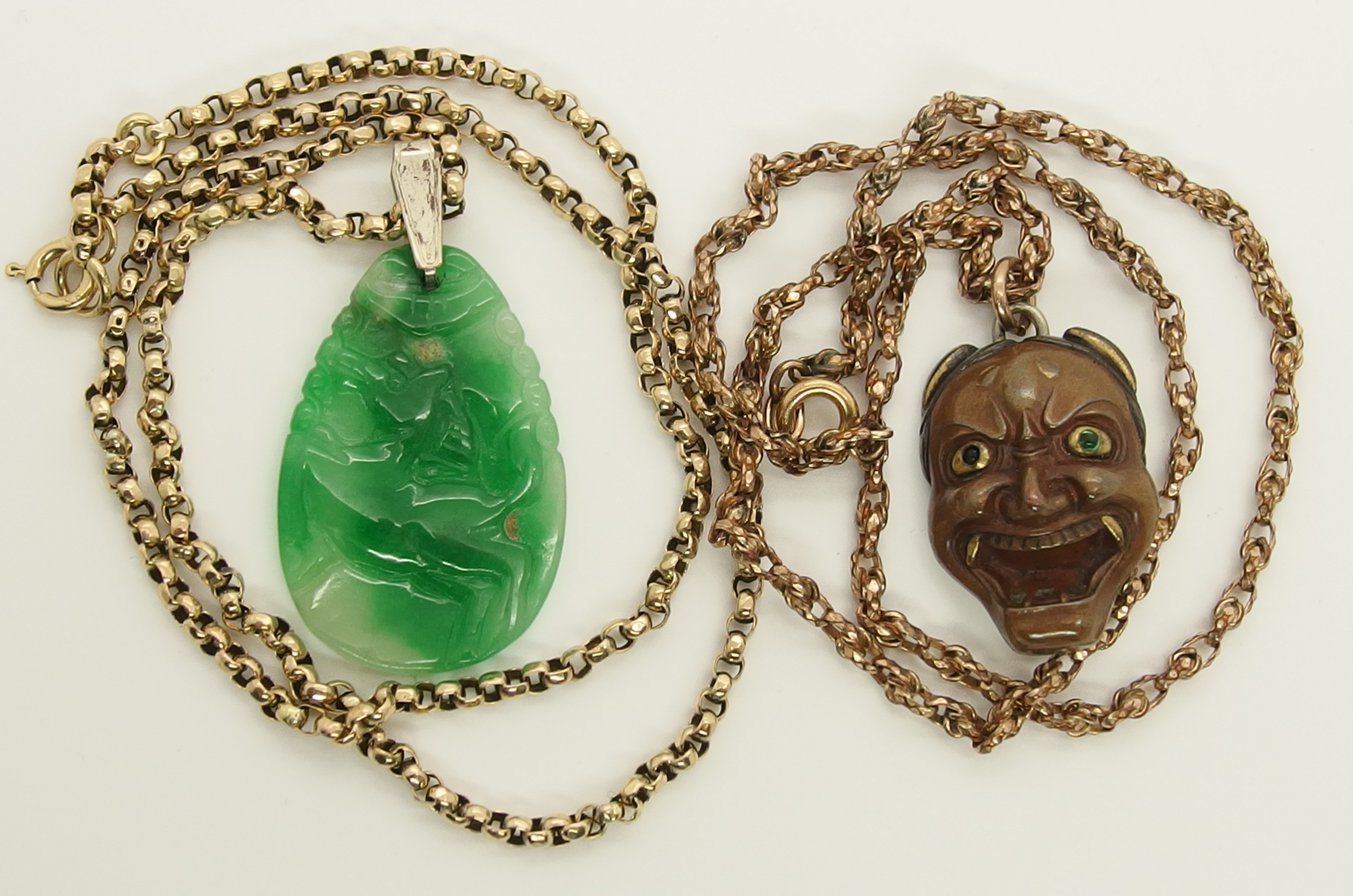 A Chinese green hardstone pendant and a Japanese demon mask pendant the hardstone pendant is - Image 2 of 7