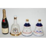 A bottle of Moet & Chandon Champagne 75cl, 12% vol in carton and three Bells decanters