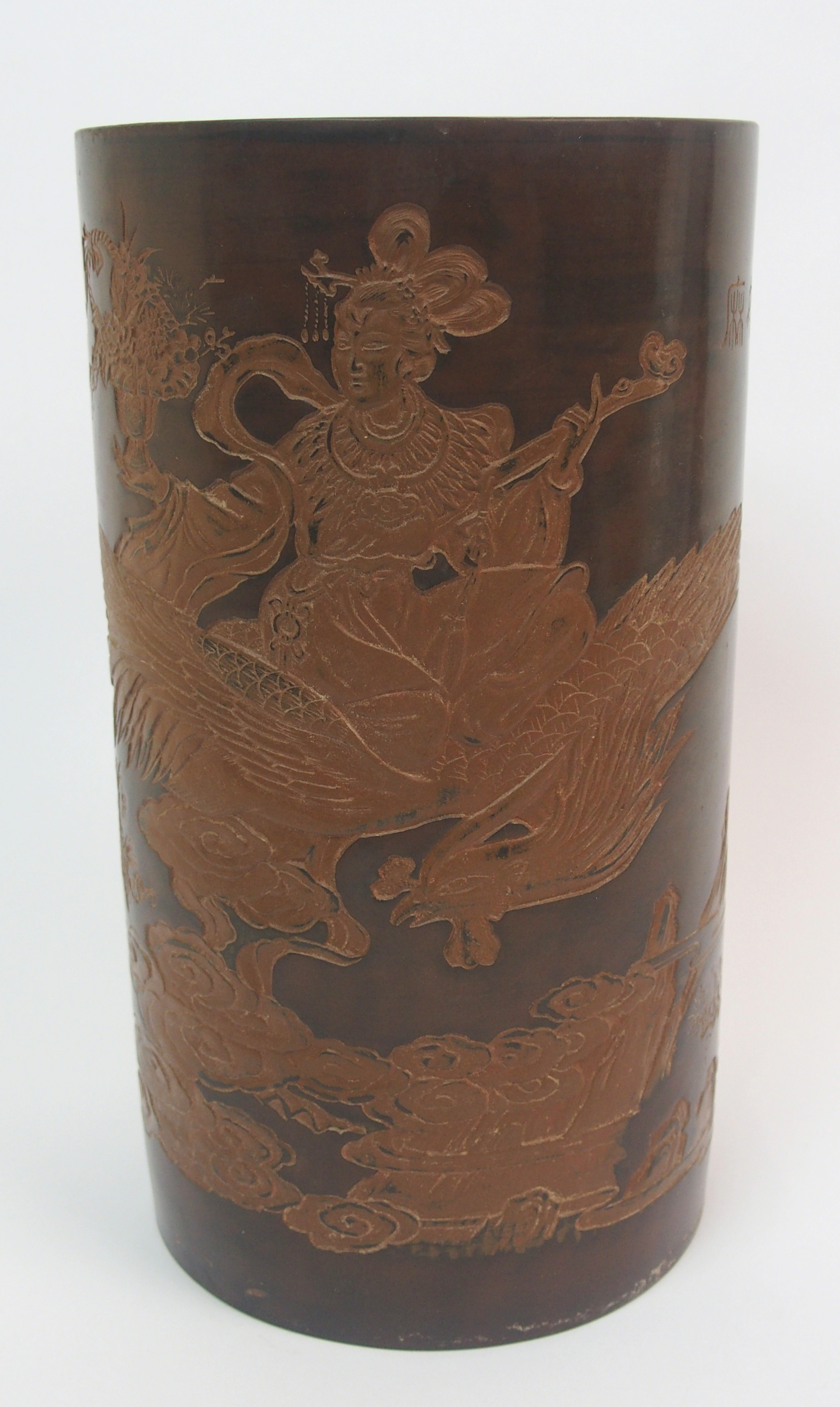 A Yixing cylindrical vase carved with a Goddess riding on a phoenix, above an attendant offering