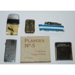 Four various lighters and vesta case and a pack of unused Player's No.3 cigarettes