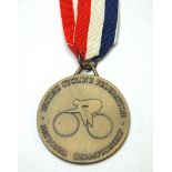 A yellow-metal British National Championship gold medal the obverse inscribed British Cycling