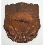 An Arts and Crafts copper wall clock with hammered and relief decoration of two cockerels and the