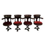 Eight Victorian mahogany ships revolving armchairs with carved vase shaped splats above drop-in
