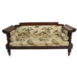 A continental stained wood settee with Japanese upholstery, with arms above baluster legs, 86cm high