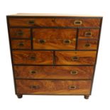 A Victorian camphorwood military campaign chest the upper section fused with a long drawer above a