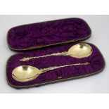 A pair of cased silver-gilt apostle spoons by Charles Boyton (II), London 1882, the bowl each