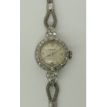 A vintage ladies diamond set Zenith watch the case is engraved 'platinum' and set with estimated