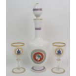 A pair of MacCallum/Malcolm Clan Crest wine glasses each with an enamelled circular plaque painted