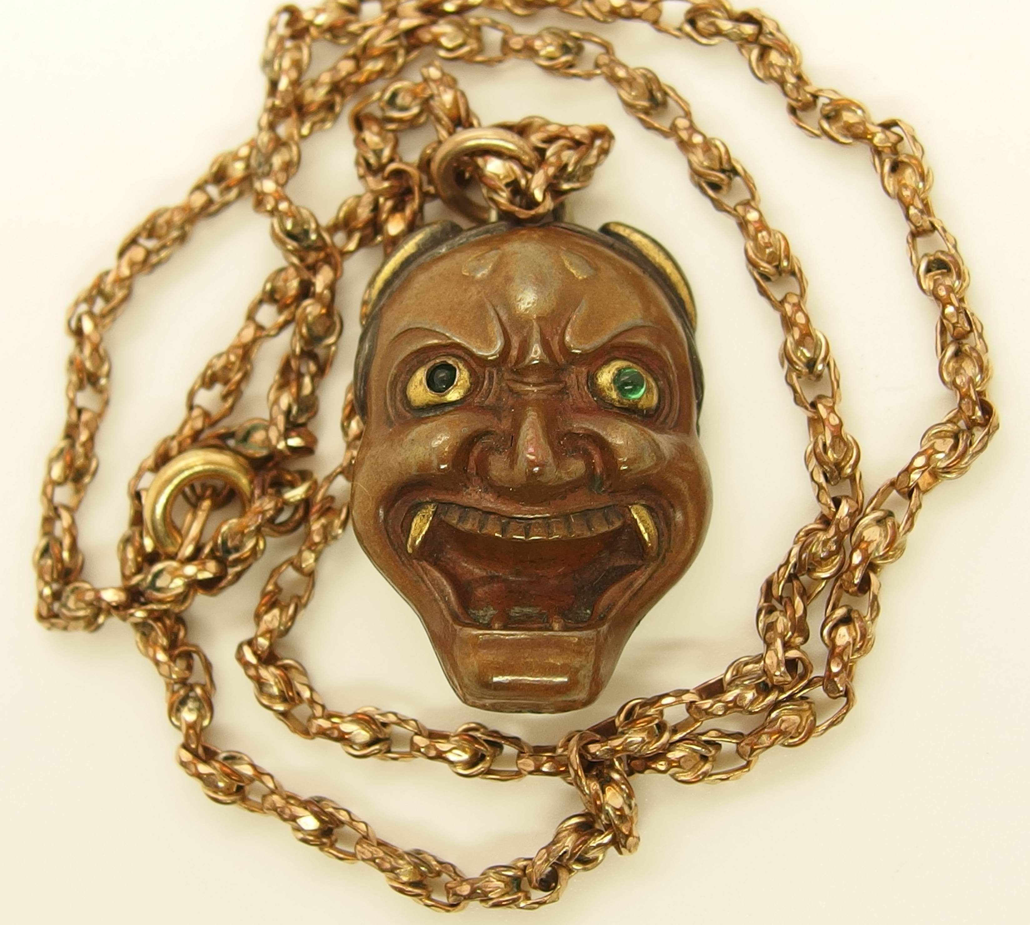 A Chinese green hardstone pendant and a Japanese demon mask pendant the hardstone pendant is - Image 4 of 7