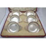 A cased set of six silver porringers with pierced handles by Edward & Sons, Glasgow, 1912 in