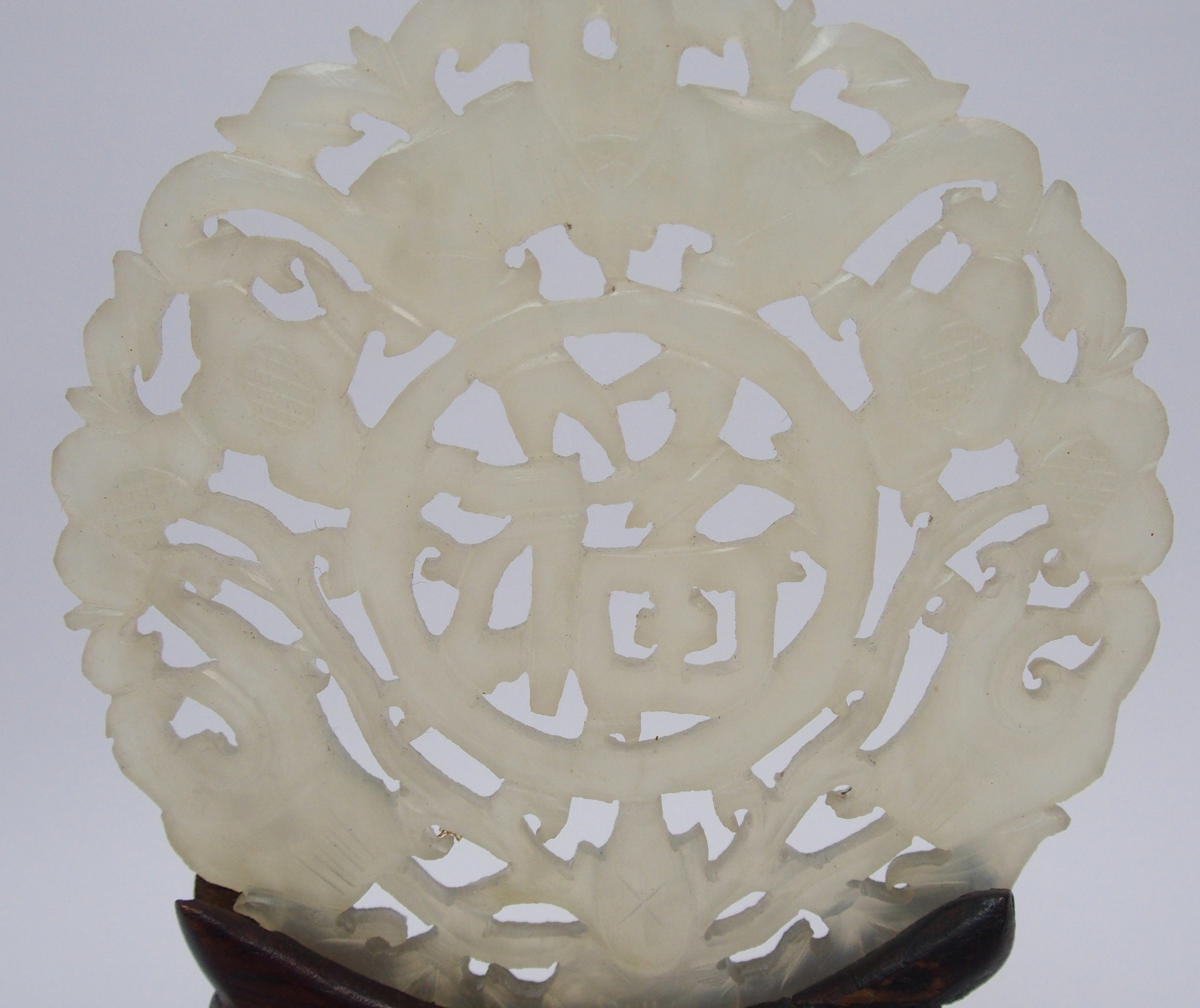 A Chinese hardstone medallion carved with bats surrounding characters, 7cm diameter, wood stand - Image 8 of 10