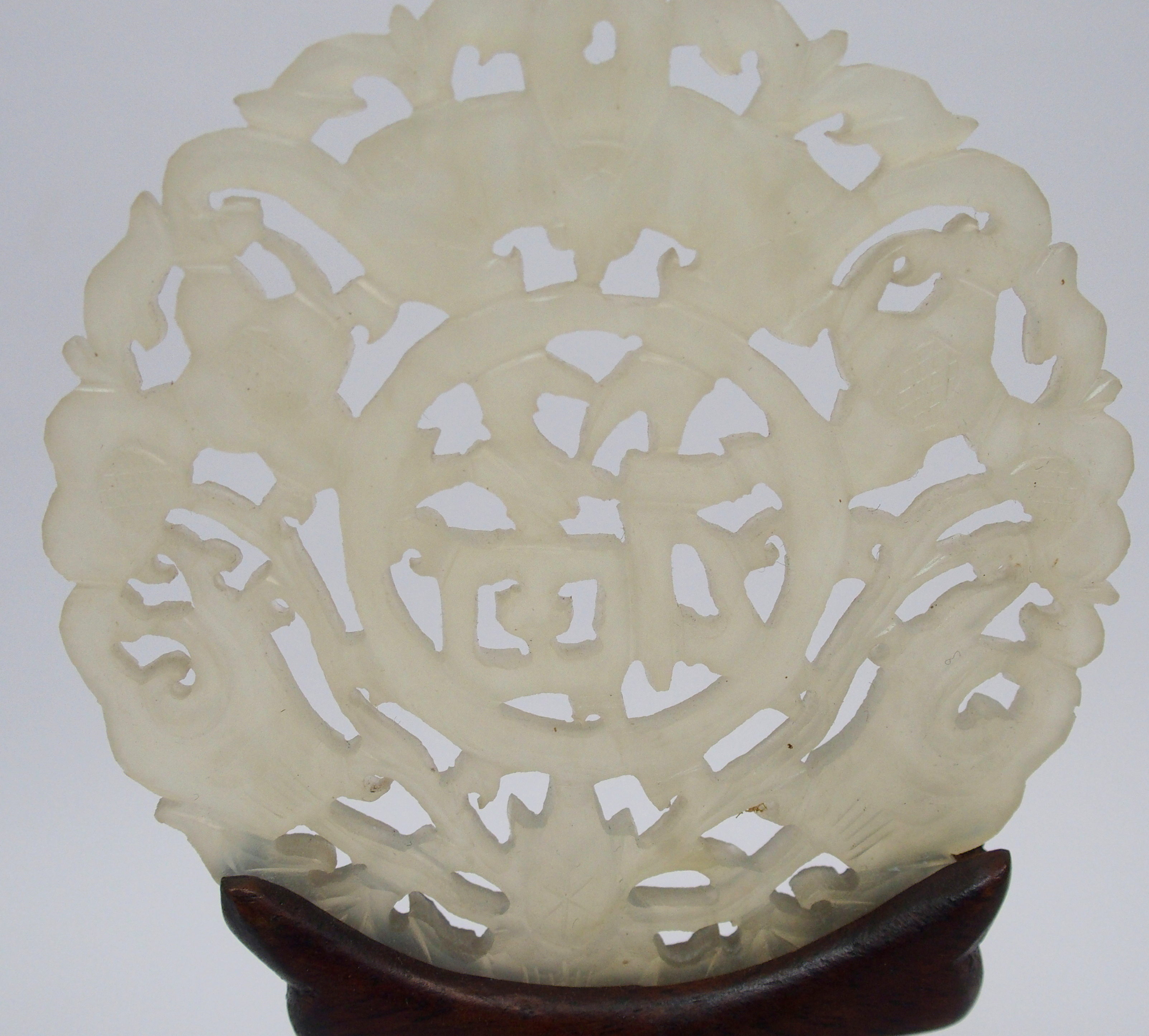 A Chinese hardstone medallion carved with bats surrounding characters, 7cm diameter, wood stand - Image 9 of 10