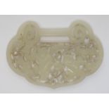 A Chinese jade belt buckle pierced with two figures amongst flowering branches and flying bats, 8.