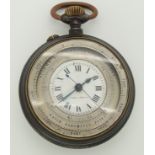 A steel cased watch barometer the white enamel dial painted with black Roman numerals and made in