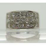 An 18ct white gold and princess cut diamond ring made by Eric Smith the three rows of diamonds