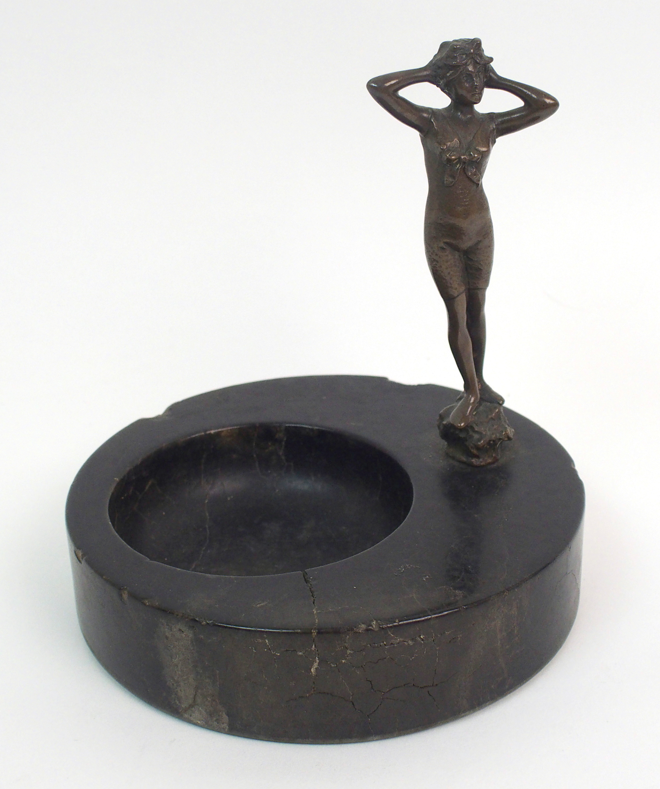 An Art Deco veined black marble trinket dish with bronzed figure of a lady in swimming costume,