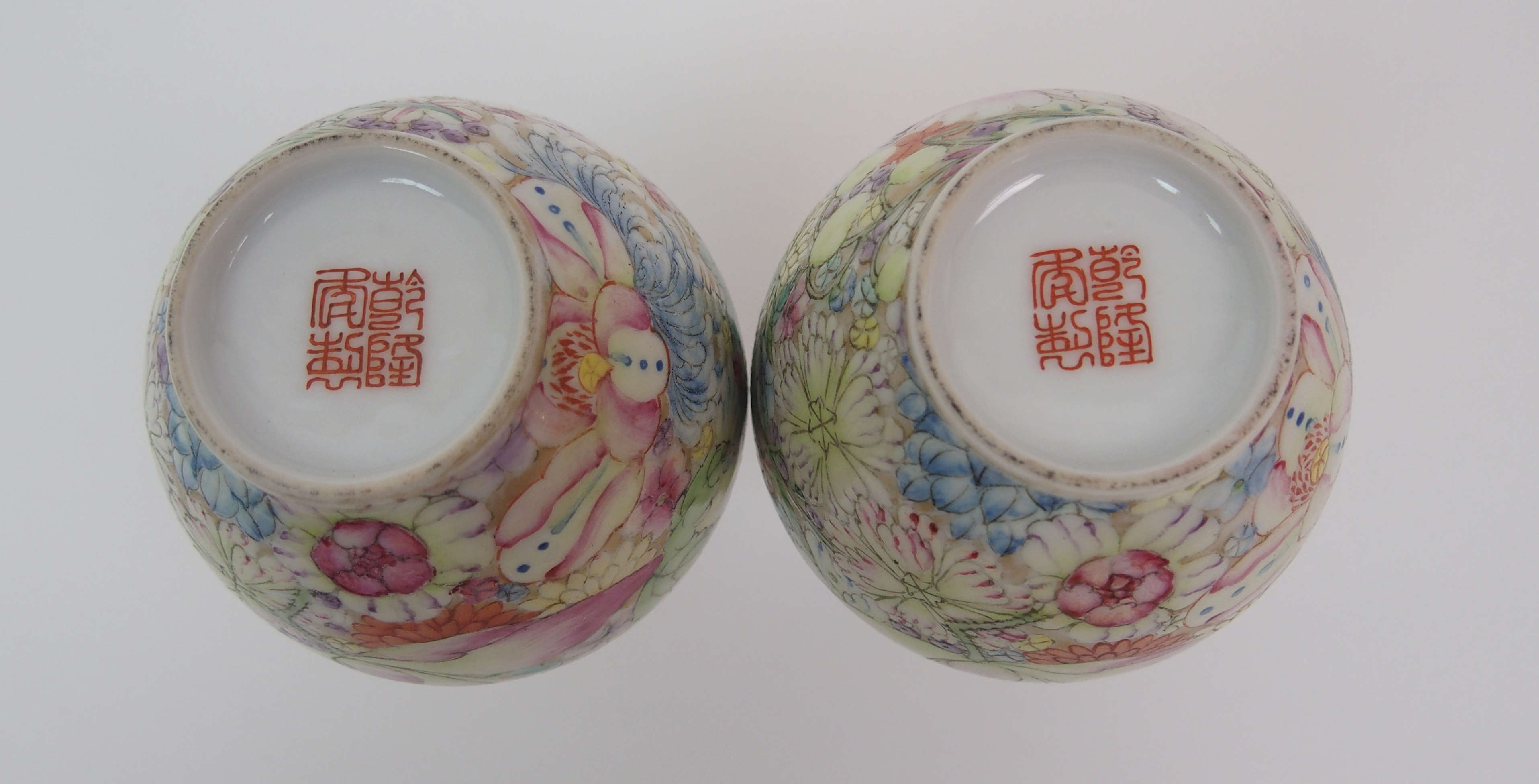 A pair of Cantonese baluster vases painted with numerous flowers, red seal marks, (rim chip to - Image 5 of 10