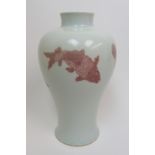 A Chinese baluster vase painted in iron red with four fish, kangxi six character mark but later in
