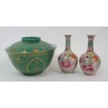 A pair of Cantonese baluster vases painted with numerous flowers, red seal marks, (rim chip to