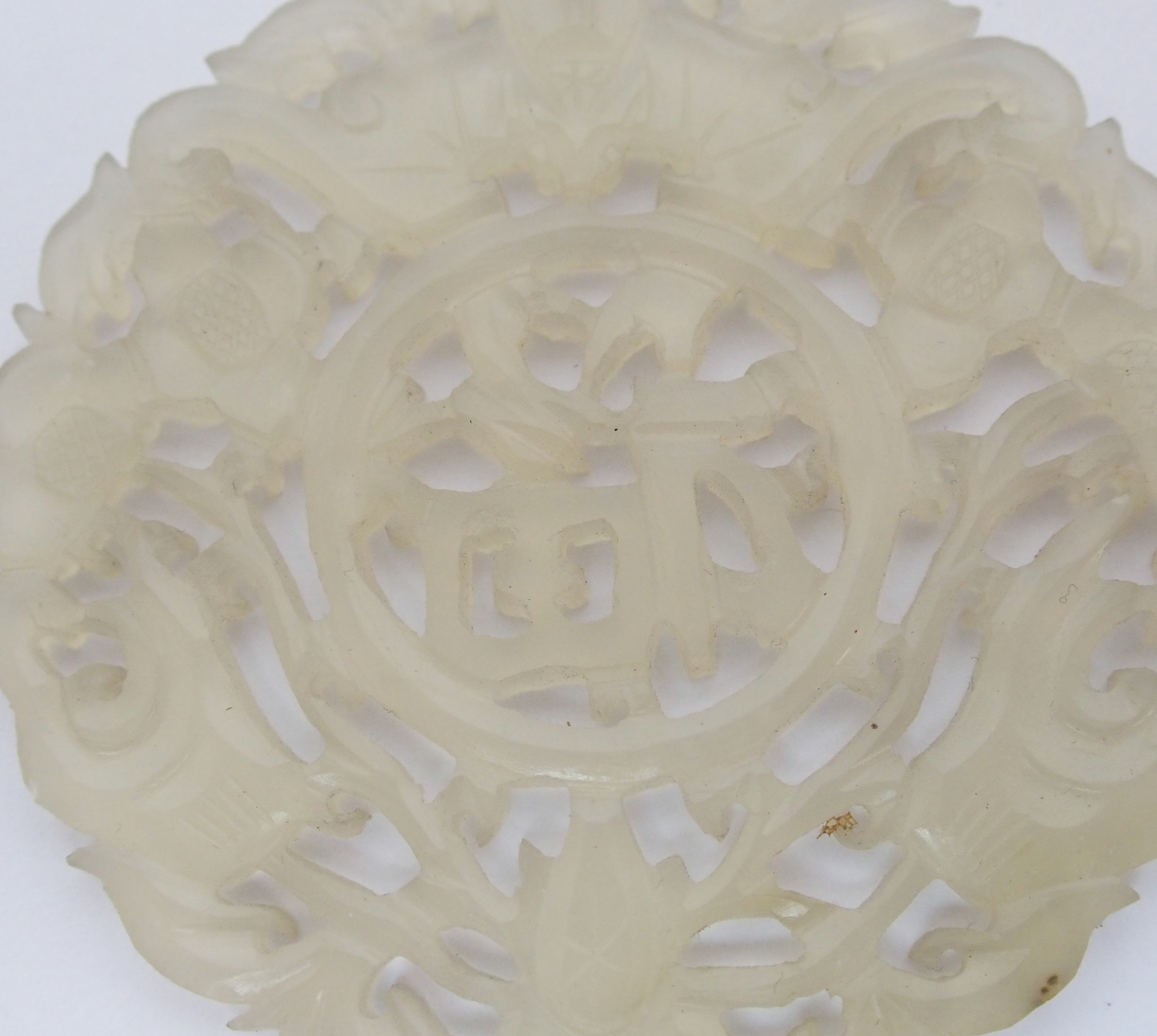 A Chinese hardstone medallion carved with bats surrounding characters, 7cm diameter, wood stand - Image 7 of 10