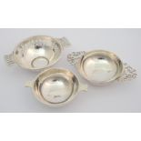 A silver quaich with pierced handles by James Ramsey, London 1924, another pierced silver quaich