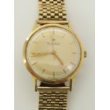 A 14ct gold Cortebert gents watch with a 9ct gold strap, the champagne dial has gold coloured