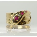 An 18ct gold ruby and diamond set snake ring finger size R, weight approx 7.2gms