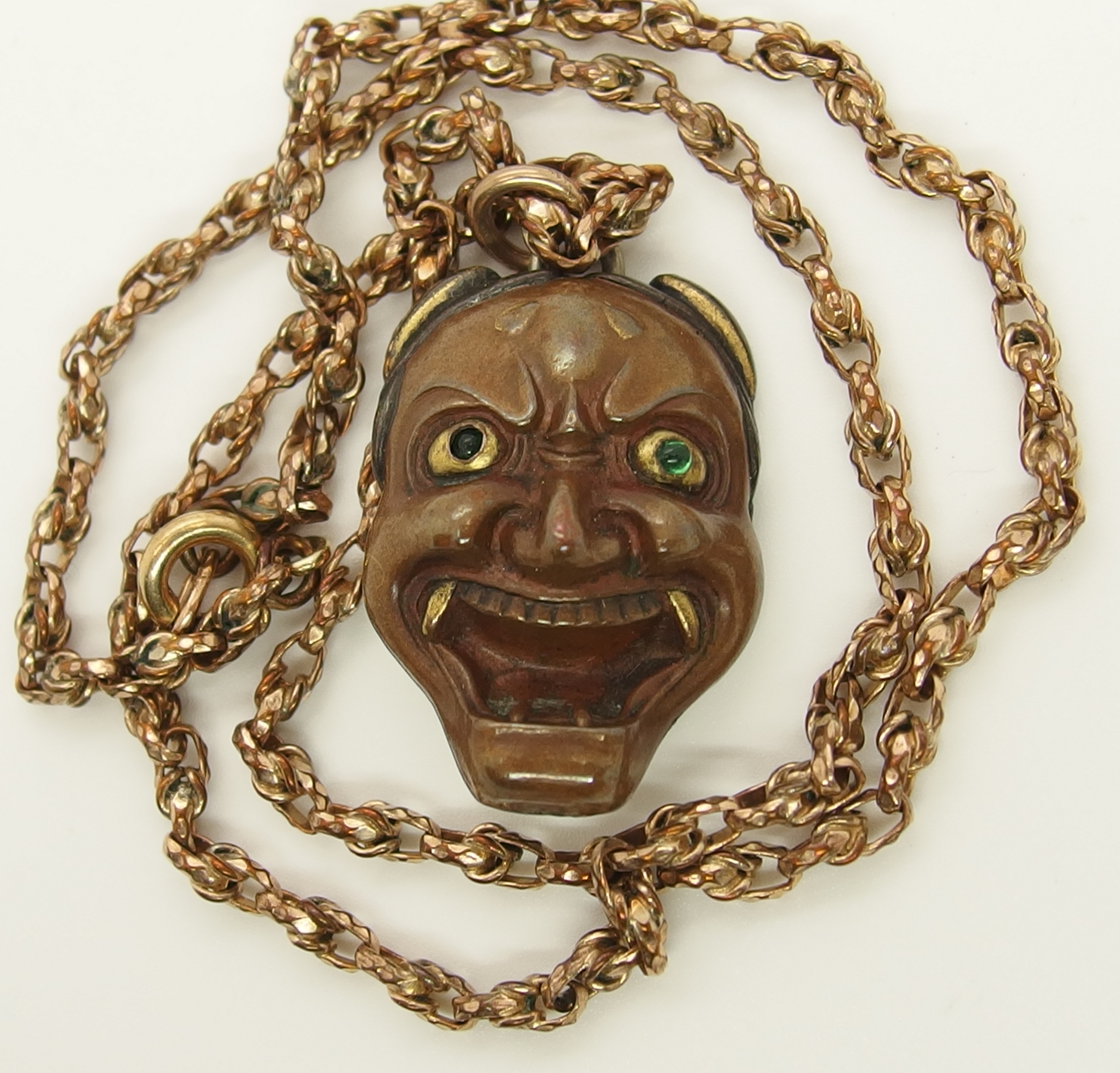 A Chinese green hardstone pendant and a Japanese demon mask pendant the hardstone pendant is - Image 7 of 7