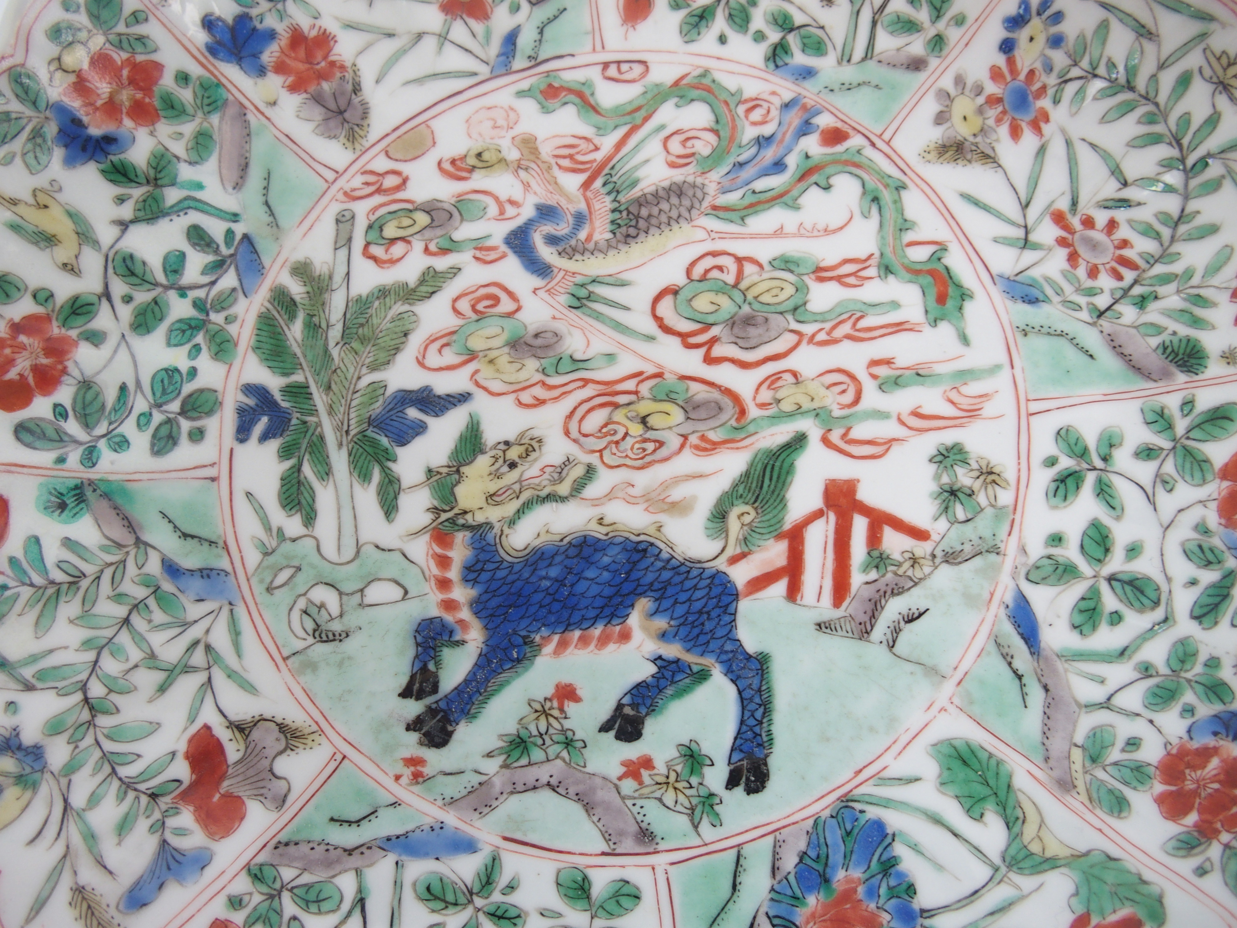 A Chinese lobed dish painted with a kylin and phoenix within panels of birds amongst flowering - Image 2 of 10