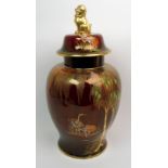 A large Carlton Ware New Stork jar and cover on rouge royale ground and with fo dog finial,