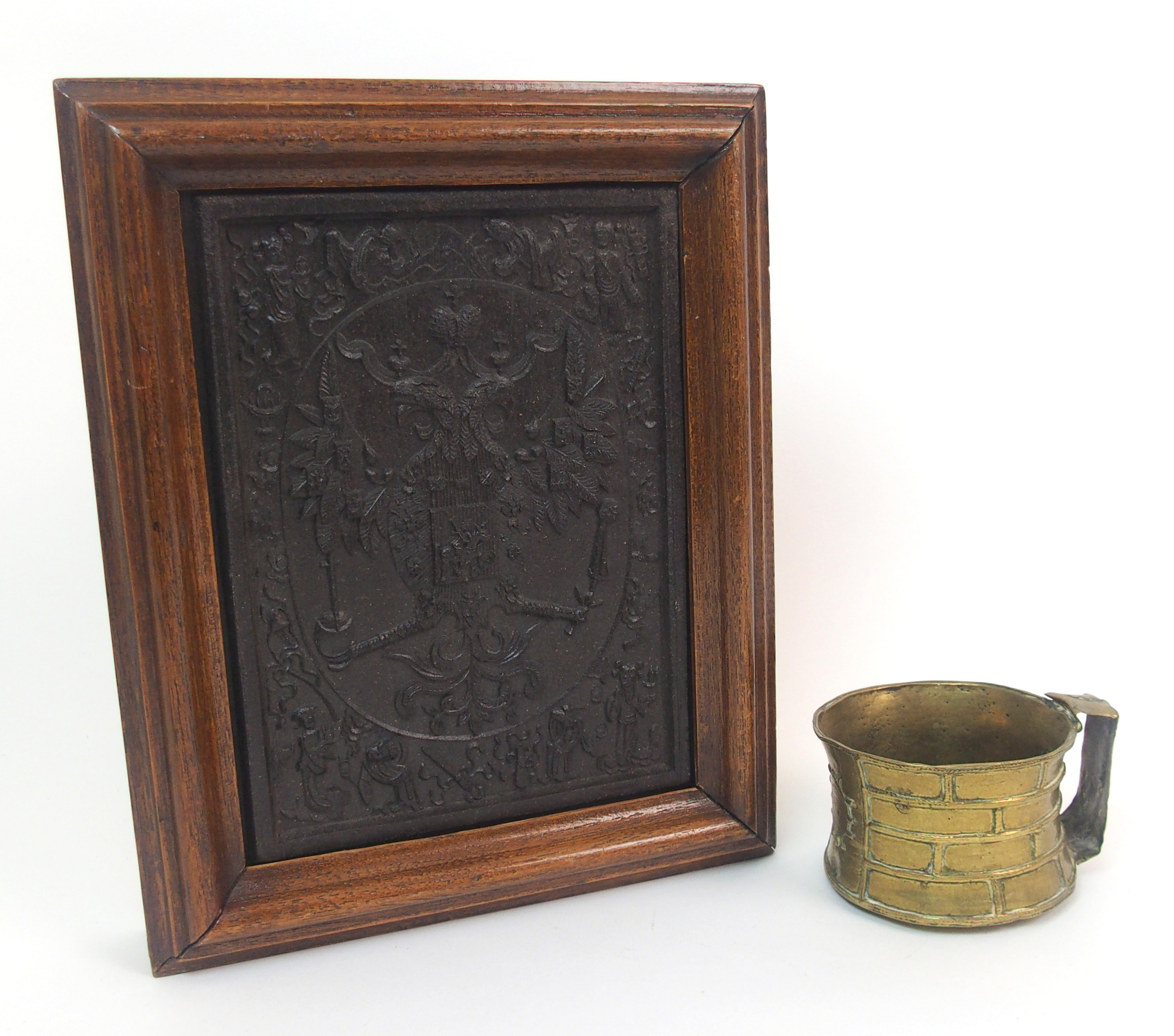 A Chinese tea block moulded with Austro-Hungarian emblem surrounded by Orientals, 21 x 16cm and an