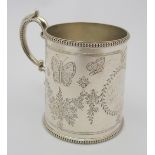 A Victorian silver christening mug by Thomas White, London 1874, the body decorated with floral