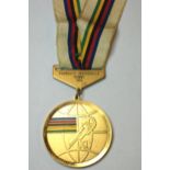 A yellow-metal and enamel World Championship Men's Individual Pursuit gold medal the obverse